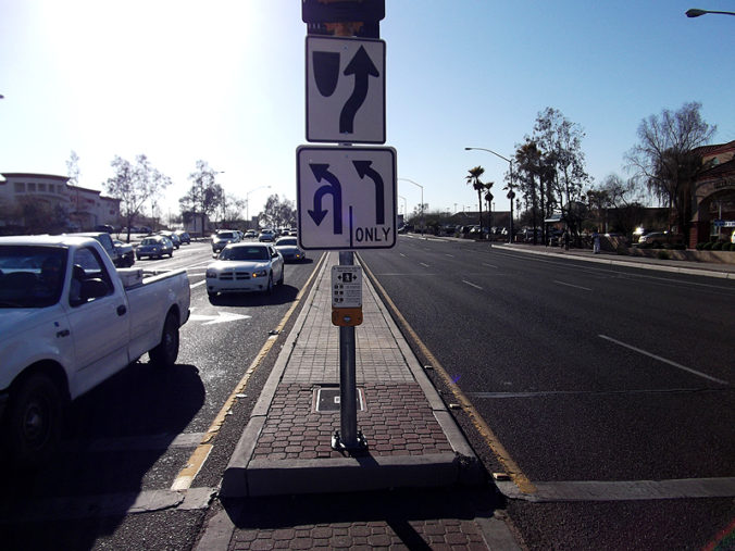 Street signs showing turning lanes